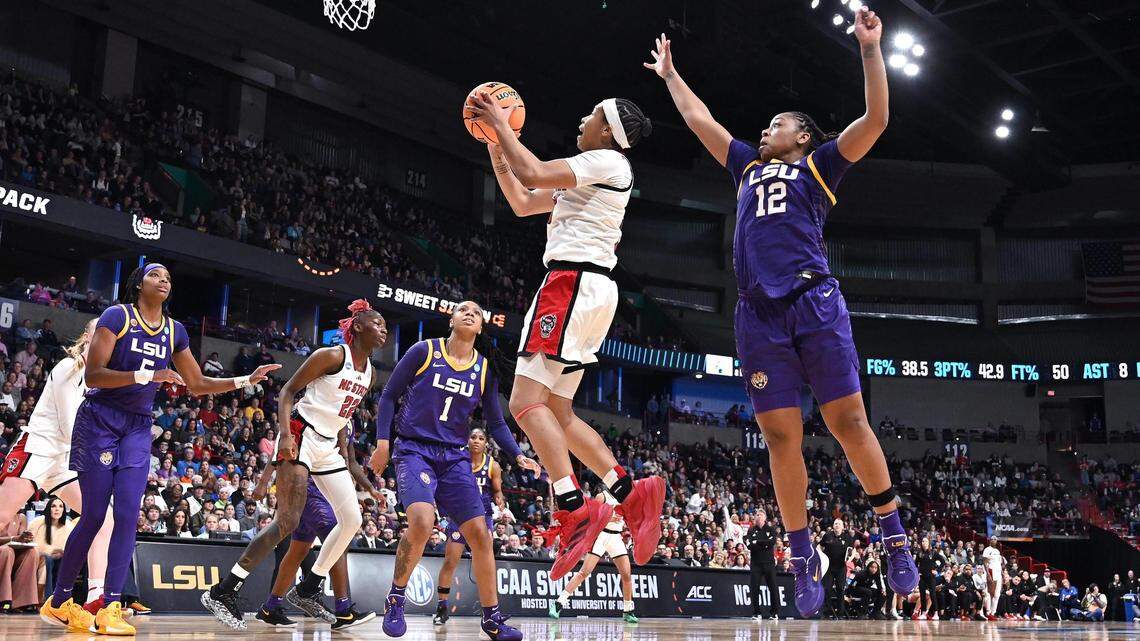 NC State Wolfpack guard Zoe Brooks (35) shoots against LSU Lady Tigers guard Mikaylah Williams (12) during the first half of a Sweet 16 NCAA Tournament basketball game at Spokane Arena.