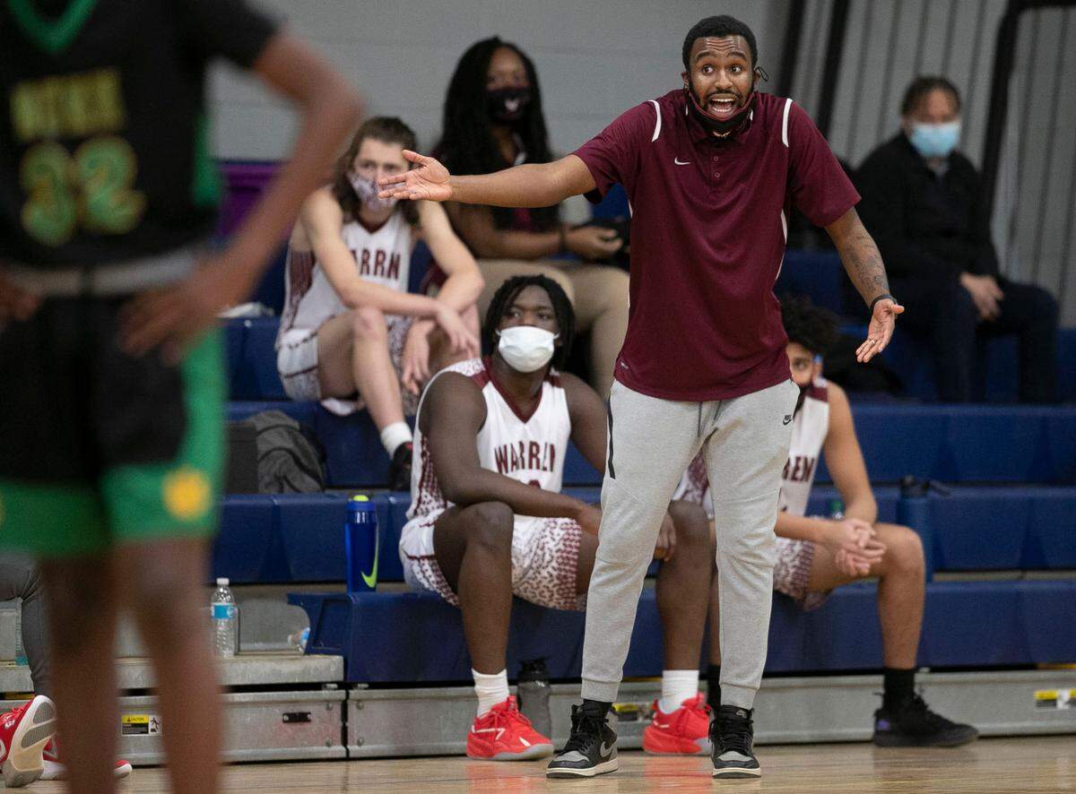 Warren County High School coach Toriano McRae Jr. directs his team  during the third quarter against Bunn High School on Tuesday, February 2, 2021 in Warrenton, N.C.