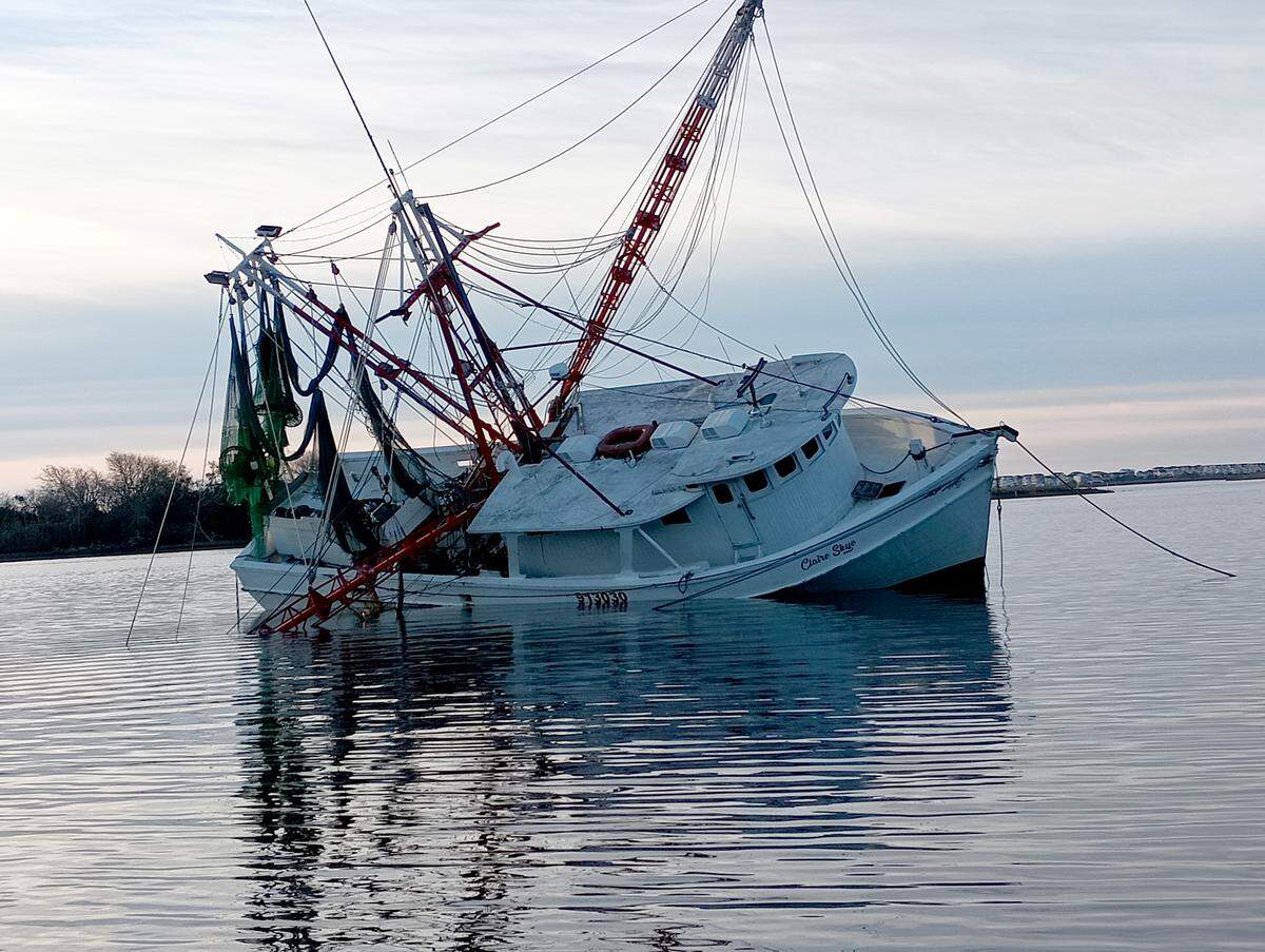 An abandoned fishing boat, the Claire Skye, in Stump Sound near the Morris Landing Clean Water Preserve in Holly Ridge. The boat is one of 12 that will be removed from coastal North Carolina waters with a grant from the BoatUS Foundation.