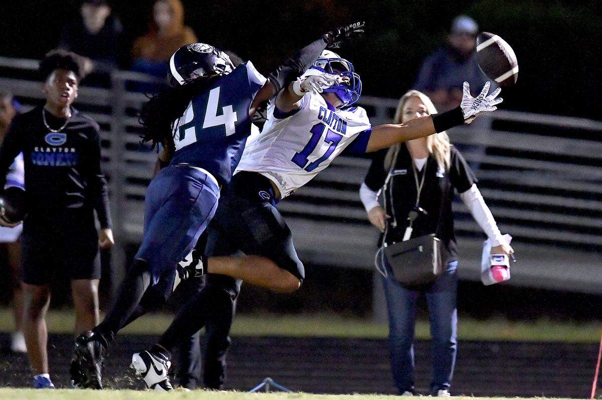 Clayton wide receiver Parker Ferguson (17) misses the catch while defended by Southeast Raleigh defensive back Mike Rowland (24) defends during the first half. The Southeast Raleigh Bulldogs and the Clayton Comets met in a non-conference football game in Raleigh, N.C. October 3, 2025.