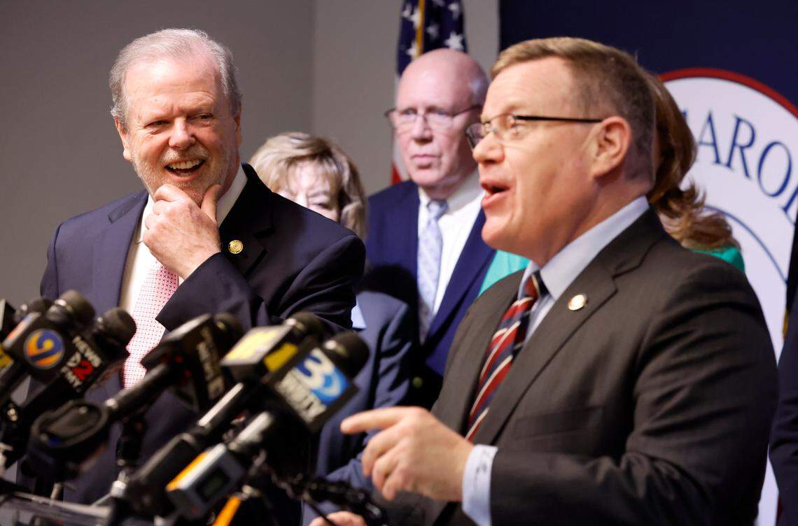 N.C. Senate leader Phil Berger, left, and House Speaker Tim Moore, right, share a laugh during a press conference at the N.C. GOP headquarters in Raleigh, N.C. on April 5, 2023.
