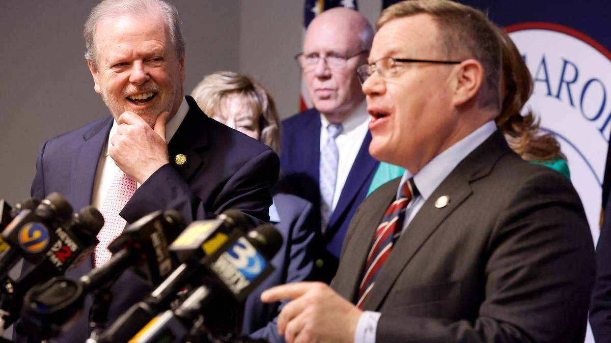 N.C. Senate leader Phil Berger, left, and House Speaker Tim Moore, right, share a laugh during a press conference at the N.C. GOP headquarters in Raleigh, N.C. on April 5, 2023.