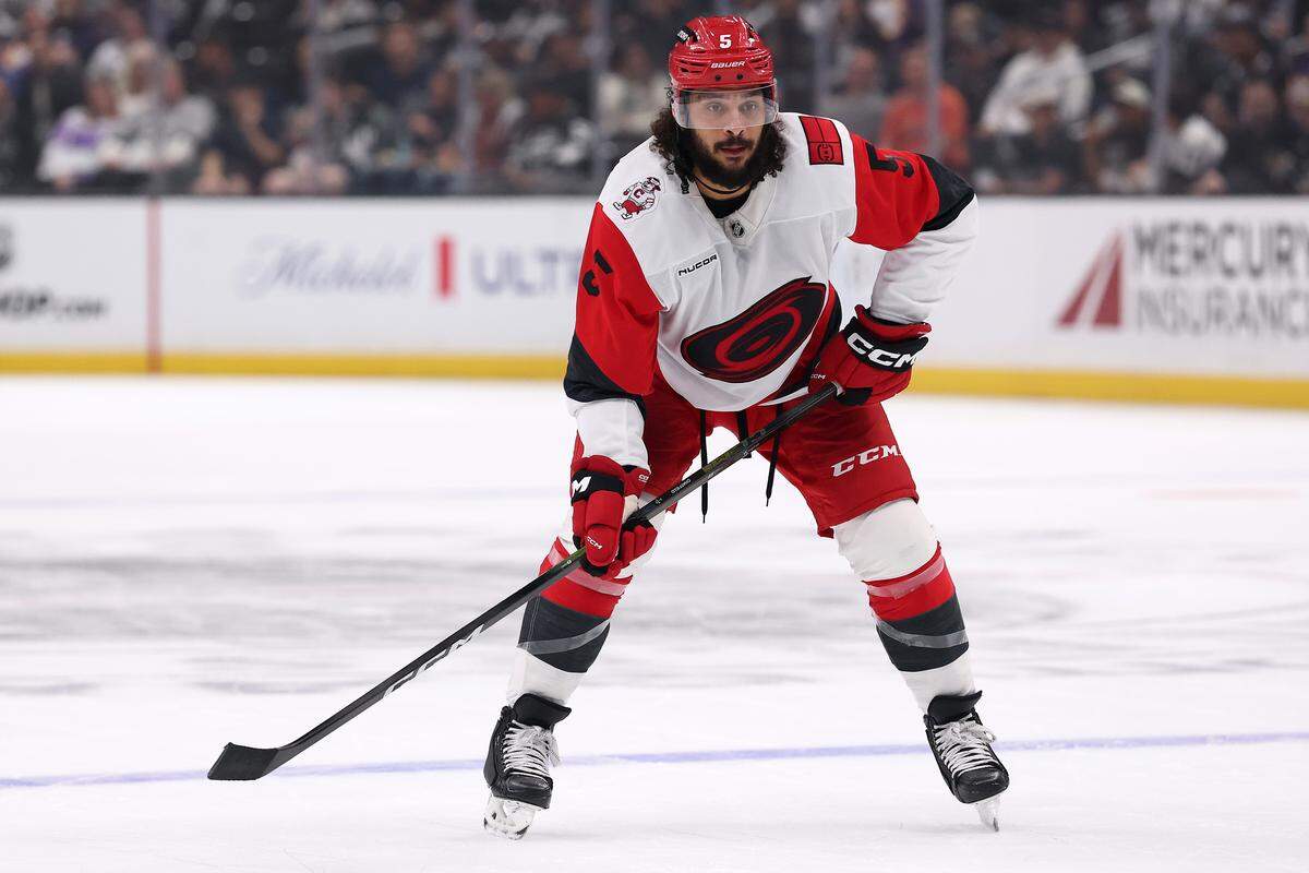 Jalen Chatfield of the Carolina Hurricanes in action against the Los Angeles Kings at Crypto.com Arena on October 18, 2025 in Los Angeles, California.