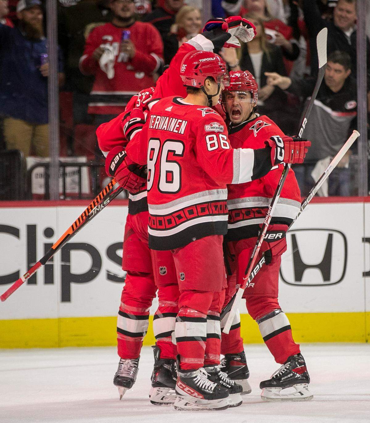 Carolina Hurricanes’ Paul Stastny (26) is surrounded by teammates Jaccob Slavin (74), Seth Jarvis (24) and Teuvo Teravainen (86) after scoring in the first period to take a 1-0 lead over the New York Islanders during game two of their Stanley Cup series on Wednesday, April 19, 2023 at PNC Arena in Raleigh, N.C.