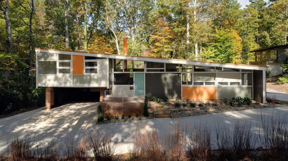 A retired Raleigh couple moved and restored George Matsumoto’s 1953 modernist house after fundraising shortfalls, using a preservation loan to complete the project.