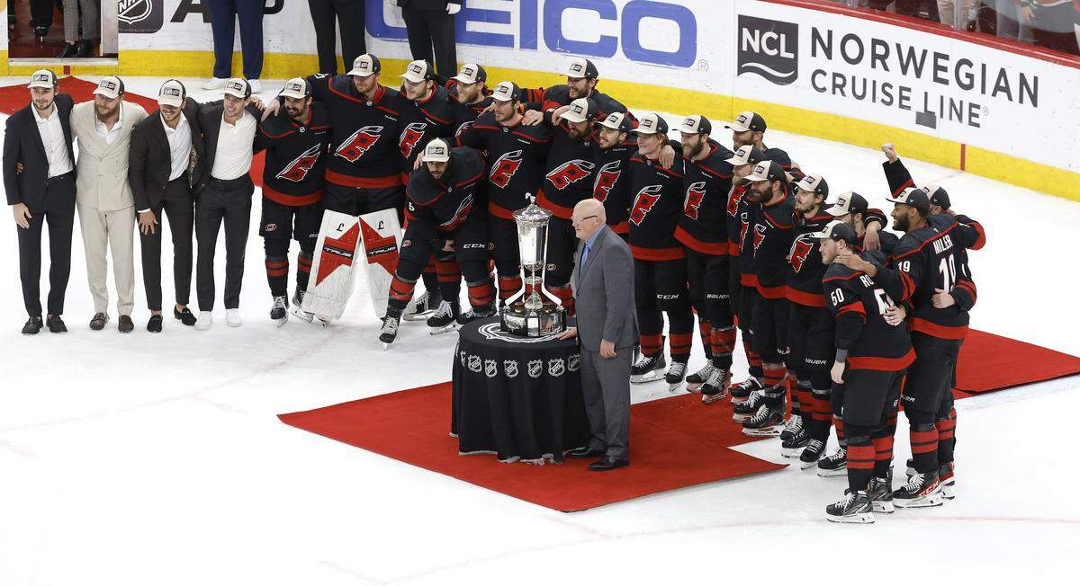 The Carolina Hurricanes pose with the Prince of Wales trophy after their 6-1 victory over the Canadiens in game five of the Eastern Conference Finals at the Lenovo Center Friday, May 29, 2026.