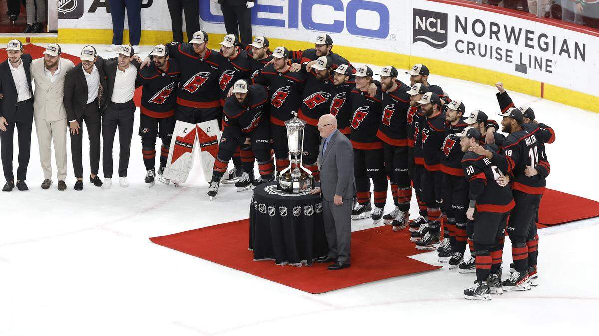 The Carolina Hurricanes pose with the Prince of Wales trophy after their 6-1 victory over the Canadiens in game five of the Eastern Conference Finals at the Lenovo Center Friday, May 29, 2026.