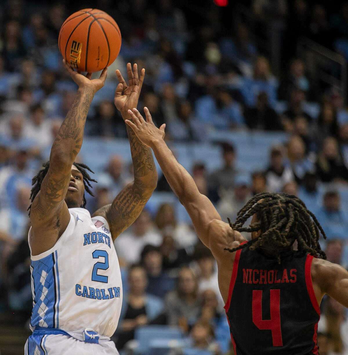 North Carolina’s Caleb Love (2) shoots over Gardner-Webb’s D.Q. Nicholas (4) during the second half on Tuesday, November 15, 2022 at the Smith Center in Chapel Hill, N.C.