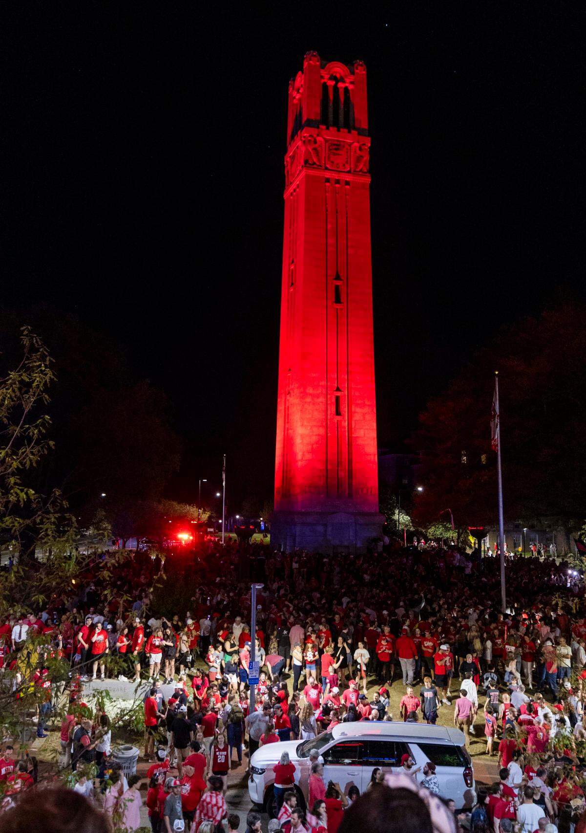 NC State fans celebrate at the Memorial Belltower on campus after the men’s basketball team’s 76-64 win over Duke to advance to the Final Four in the NCAA Men’s Division I Basketball Tournament on Sunday, March 31, 2024.
