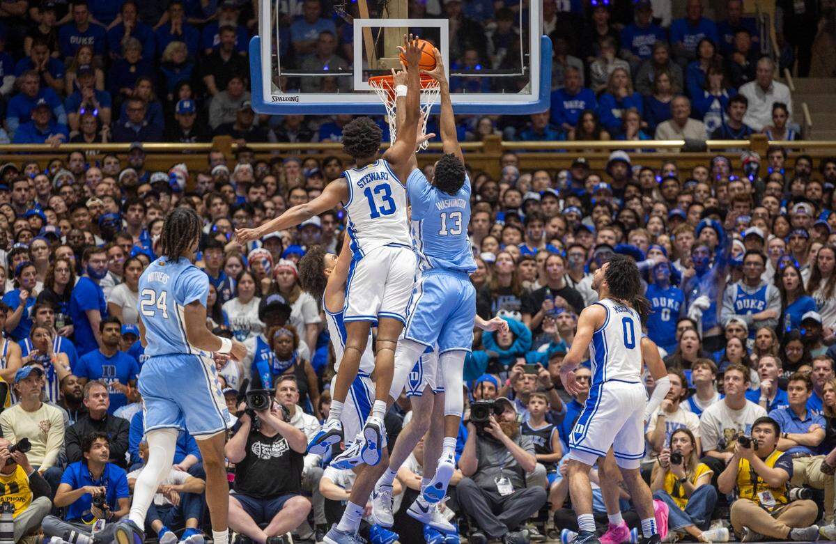 North Carolina’s Jalen Washington (13) gets a dunk against Duke’s Sean Stewart (13) during the first half on Saturday, March 9, 2024 at Cameron Indoor Stadium in Durham, N.C