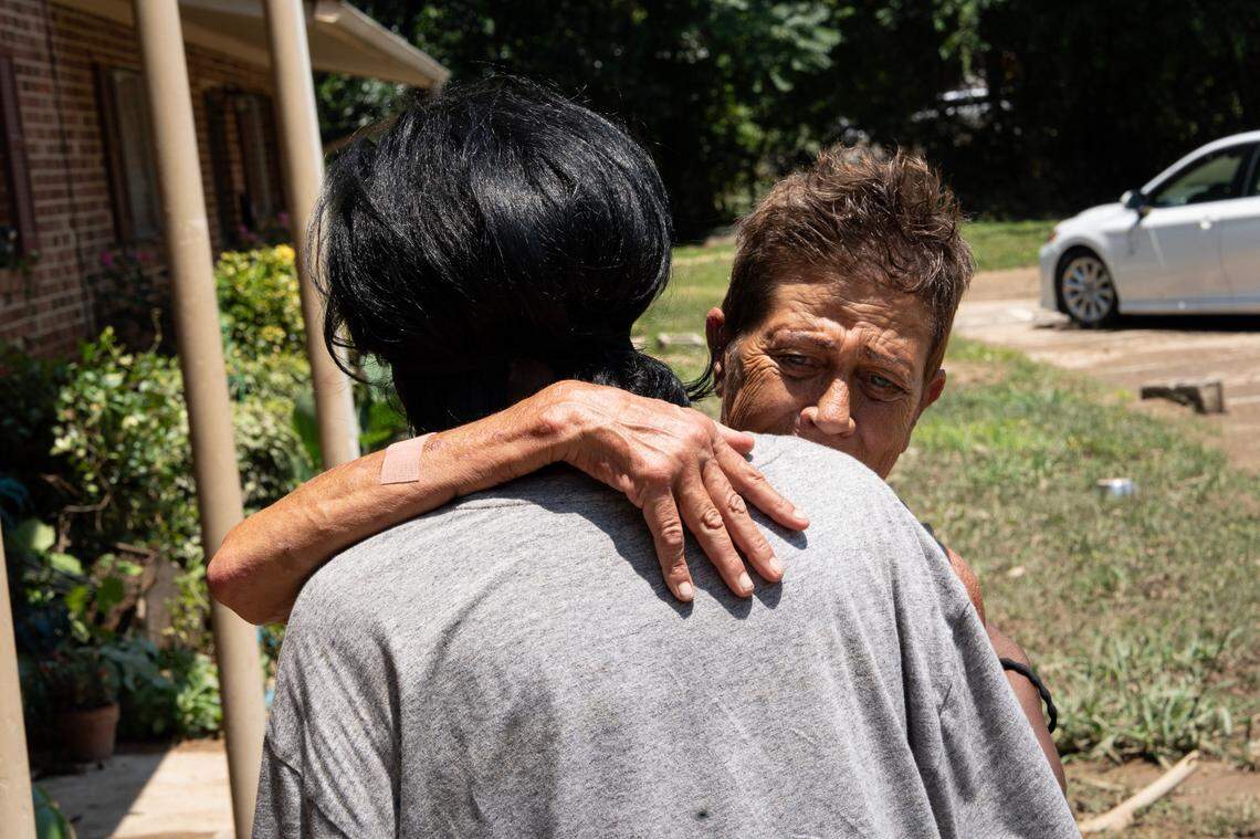 Vanessa Byrd embraces a neighbor. Residents of Camelot Apartments in Chapel Hill, N.C. experienced severe flooding on Sunday, July 6, 2025 during Tropical Storm Chantal. Many had to evacuate their homes in the middle of the night.