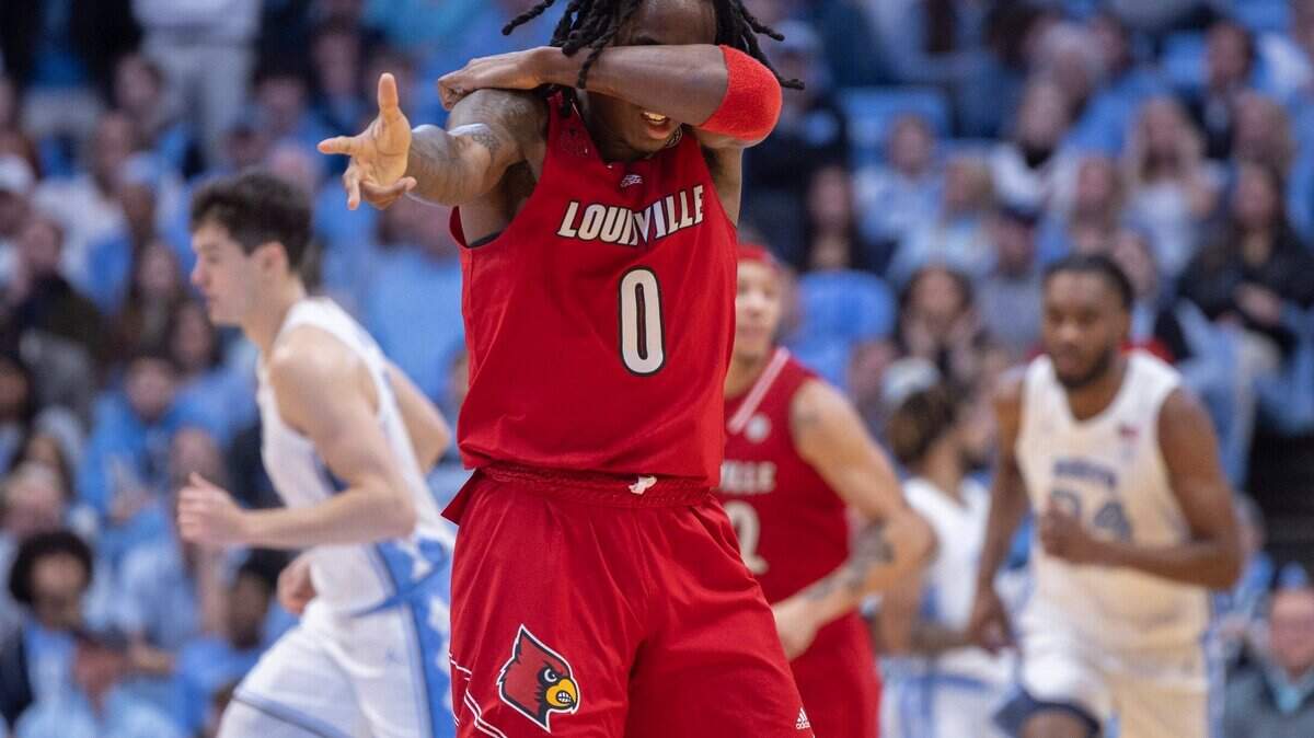 Louisville’s Mike James (0) reacts after sinking a basket to cut the North Carolina lead to five points in the second half on Wednesday, January 17, 2024 at the Smith Center in. Chapel Hill, N.C.