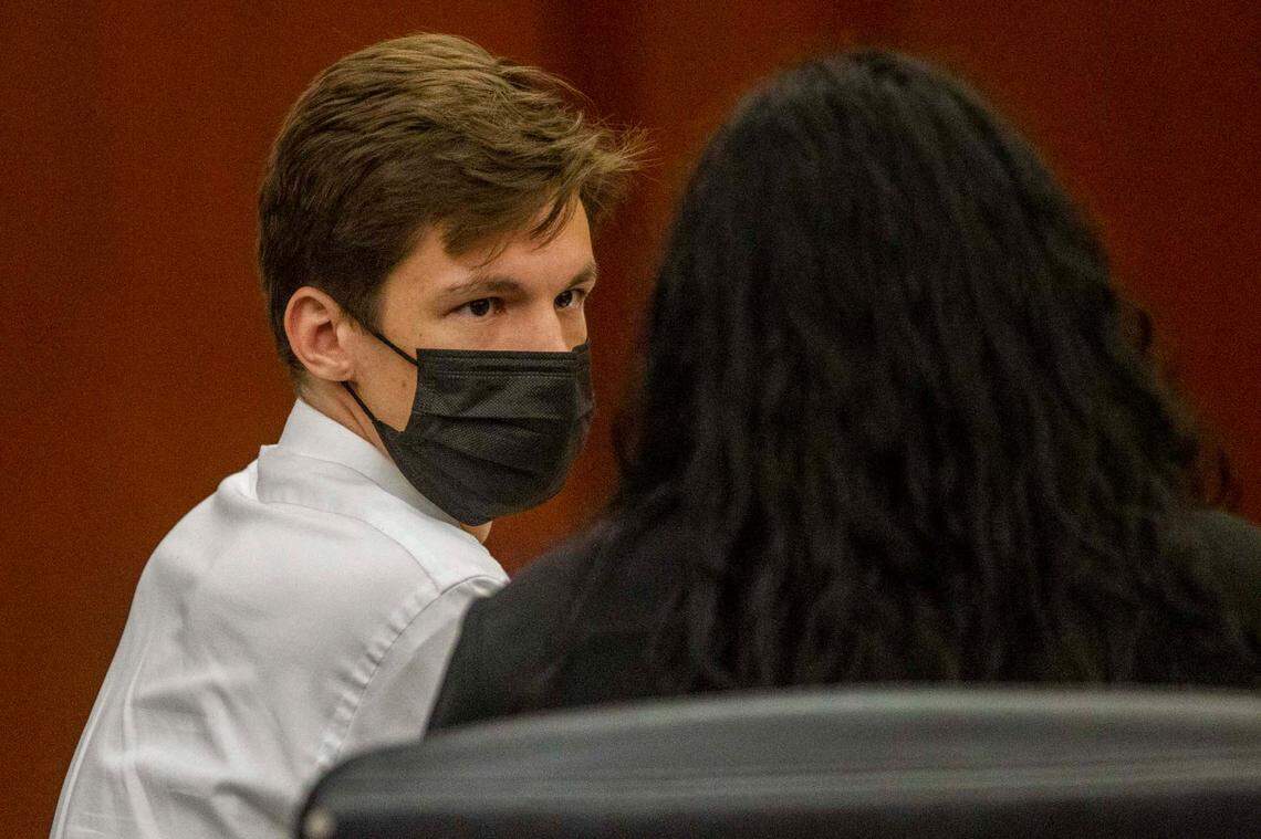 Raleigh snake collector Christopher Gifford, left, talks with his attorney Anna Smith Felt Friday, Aug. 6, 2021 at the Wake County Justice Center. Gifford pleaded guilty to failing to report a missing venomous snake and was ordered to pay storage fees and overtime costs for law enforcement officers and emergency workers who responded to the incident.