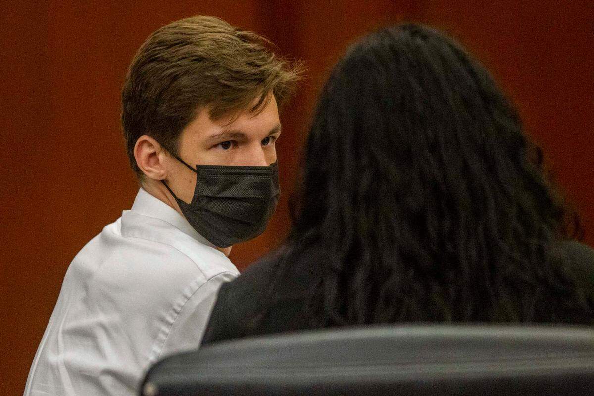 Raleigh snake collector Christopher Gifford, left, talks with his attorney Anna Smith Felt Friday, Aug. 6, 2021 at the Wake County Justice Center. Gifford pleaded guilty to failing to report a missing venomous snake and was ordered to pay storage fees and overtime costs for law enforcement officers and emergency workers who responded to the incident.