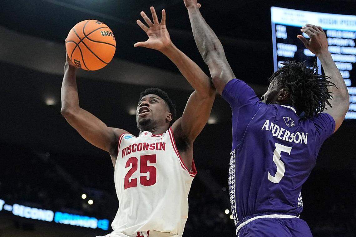 PORTLAND, OREGON - MARCH 19: John Blackwell #25 of the Wisconsin Badgers shoots against Terry Anderson #5 of the High Point Panthers during the second half in the first round of the 2026 NCAA Men's Basketball Tournament at Moda Center on March 19, 2026 in Portland, Oregon. The Panthers won 83-82 in regulation. (Photo by Soobum Im/Getty Images)