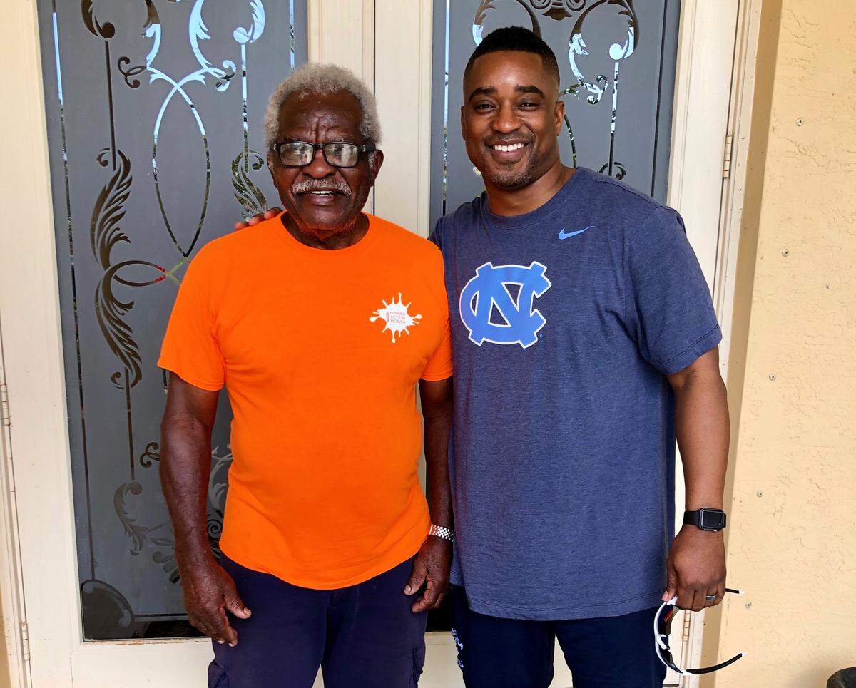 UNC football chaplain Mitch Mason, right, and his high school coach Al Sutton pose together in this 2019 photo.