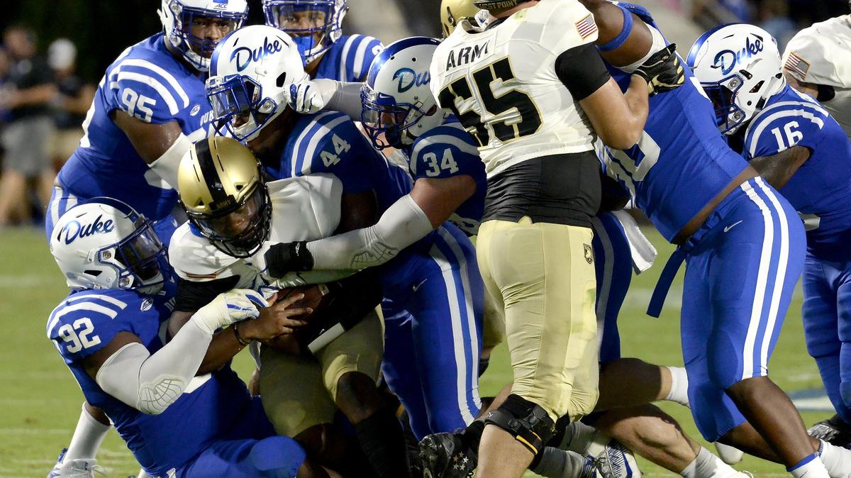 Army quarterback Kelvin Hopkins Jr. (8) is gang tackled by the Blue Devils in the second quarter. Duke opened the 2018 football season against Army at Wallace Wade Stadium in Durham, N.C., Friday, August 31, 2018.