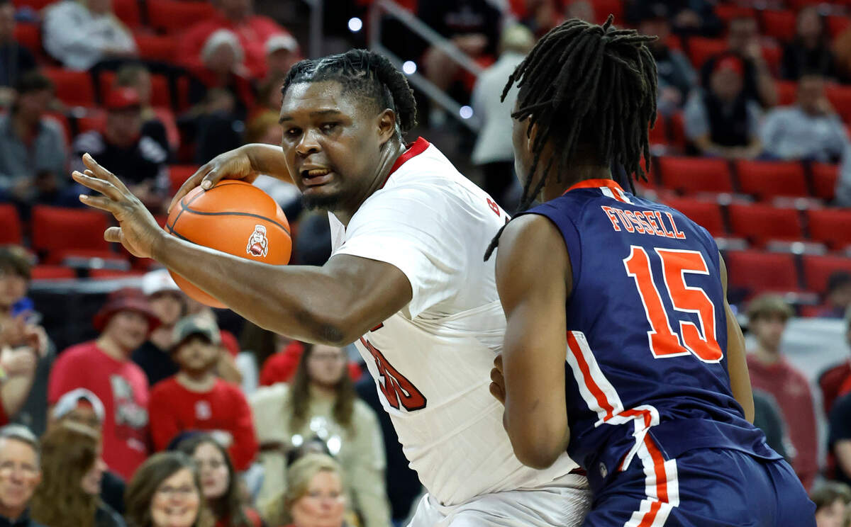 N.C. State’s DJ Burns Jr. (30) keeps the ball from UT Martin’s Christian Fussell (15) during the second half of N.C. State’s 81-67 victory over UT Martin at PNC Arena in Raleigh, N.C., Tuesday, Dec. 12, 2023.