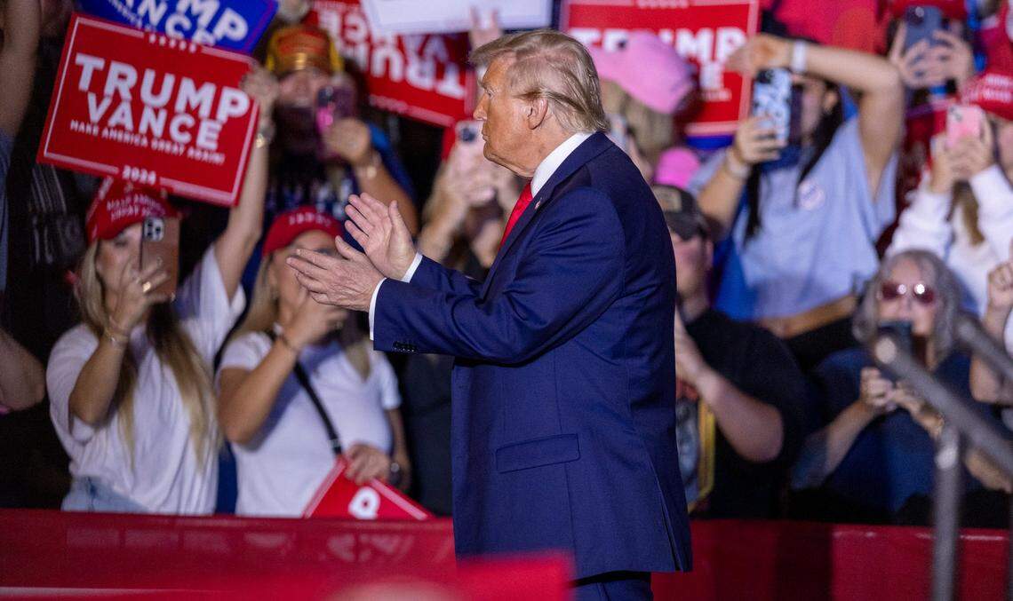 Former President Donald Trump takes the stage during a rally at Minges Coliseum in Greenville on Monday, Oct. 21, 2024. With two weeks until Election Day, Trump went on a three-city tour, in which Trump will also see the destruction caused by Hurricane Helene in Asheville and speak at a faith conference in Concord.