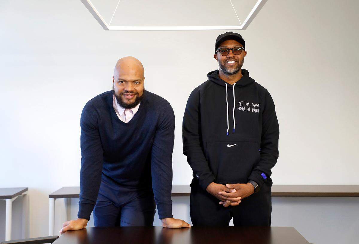 Terrence, left and Torry Holt pose in their office in downtown Raleigh Wednesday, Nov. 13, 2019.