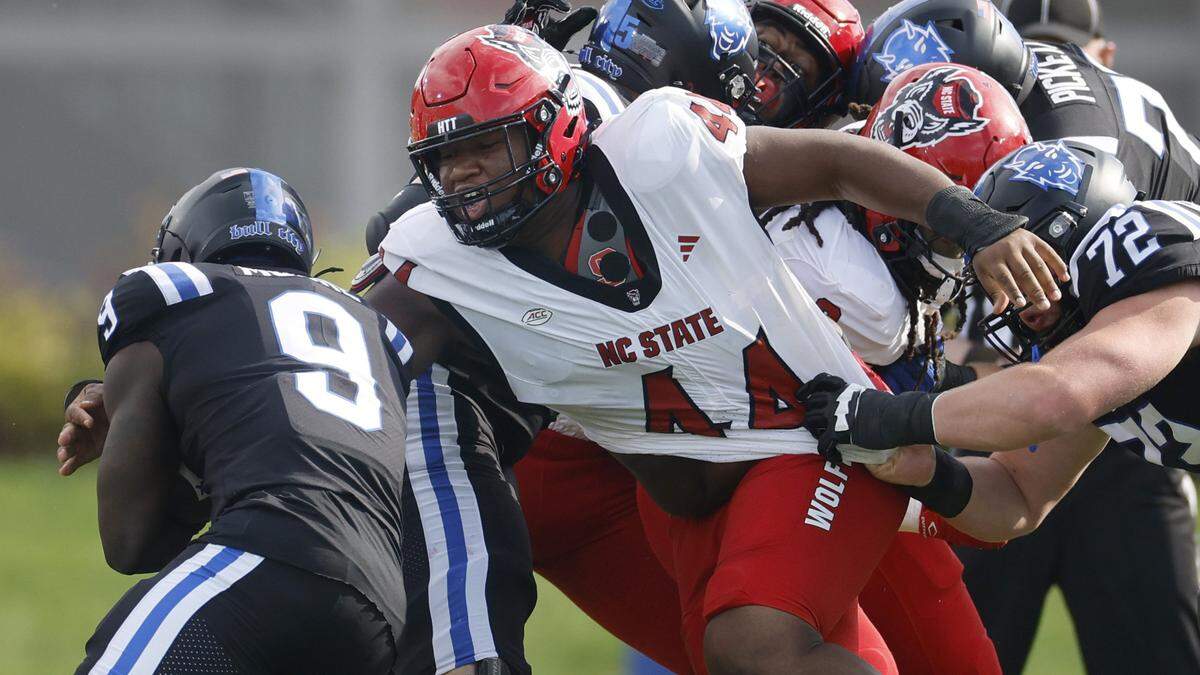 N.C. State’s Brandon Cleveland (44) tracks down Duke running back Jaquez Moore (9) during the first half of N.C. State’s game against Duke at Wallace Wade Stadium in Durham, N.C., Sat. Sept. 20, 2025.