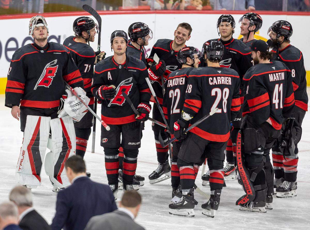 Carolina Hurricanes center Sebastian Aho (20) watches the replay after scoring the game winning goal in double overtime to secure a 5-4 victory and clinch the first round Stanley Cup series over the New Jersey Devils on Tuesday, April 29, 2025 at Lenovo Center in Raleigh, N.C.