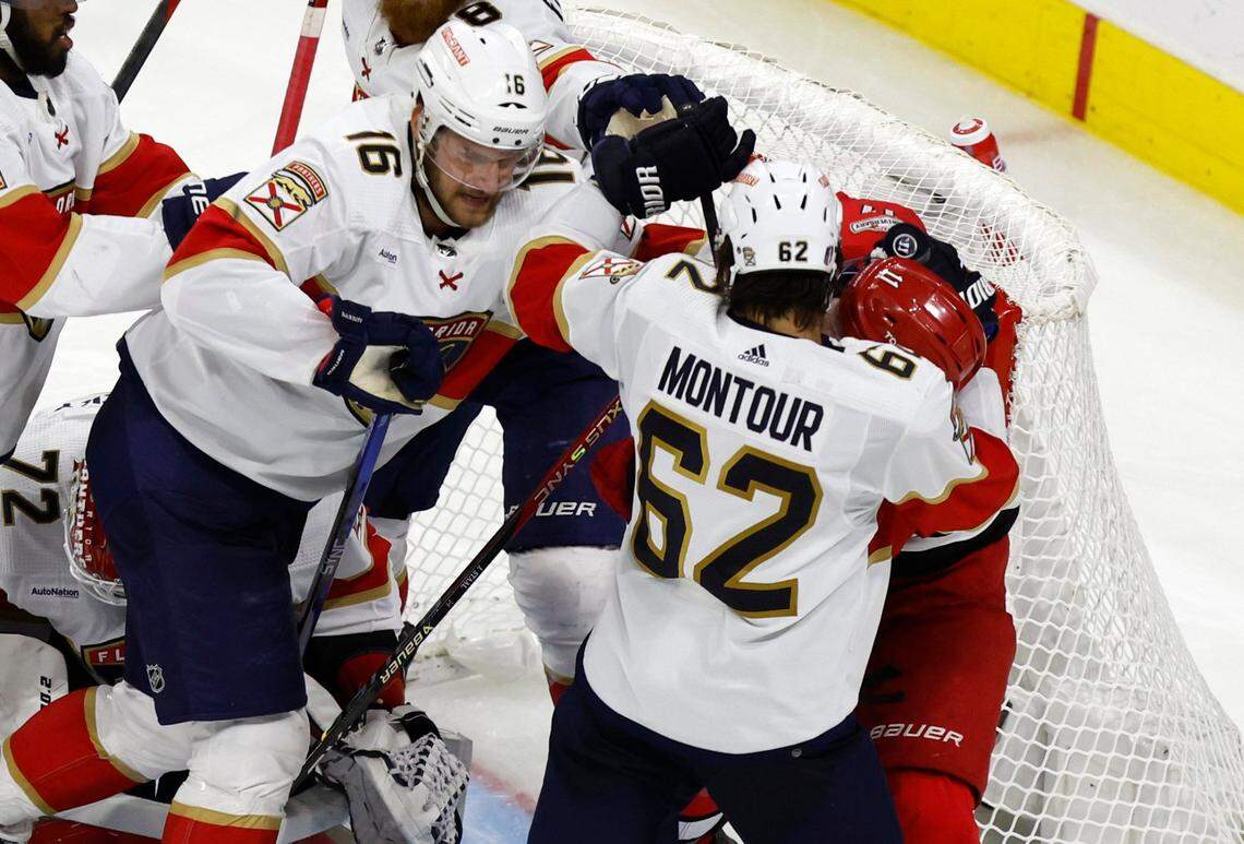Florida defenseman Brandon Montour (62) and center Aleksander Barkov (16) push Carolina center Jordan Staal (11) away from the goal during the third period of game two between the Hurricanes and Panthers in the Eastern Conference Finals at PNC Arena in Raleigh, N.C., Saturday, May 20, 2023.