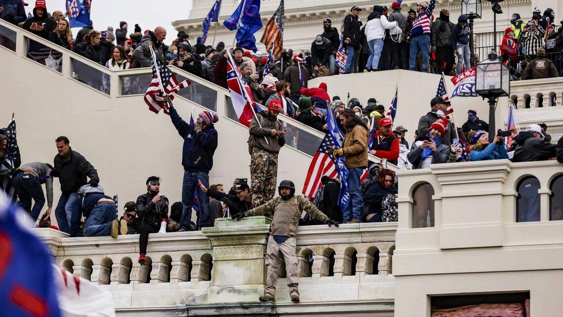 Pro-Trump supporters storm the U.S. Capitol following a rally with President Donald Trump on Wednesday, Jan. 6, 2021, in Washington, D.C. A Georgia woman was killed and at least two men from the state were arrested after the violence. (Samuel Corum/Getty Images/TNS)