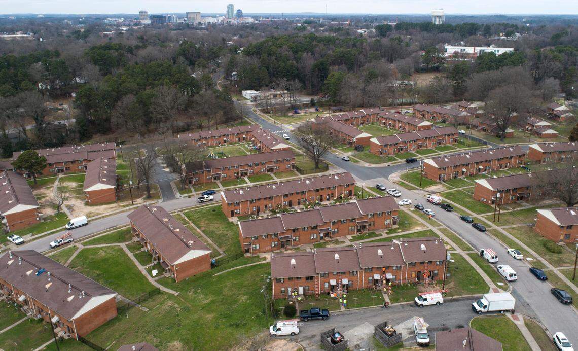In this 2020 file photo, contractors work on building renovations in McDougald Terrace in February 2020. The Durham Housing Authority started a voluntary evacuation of the public housing complex in early January amid concerns about high carbon monoxide levels, mold and other conditions.