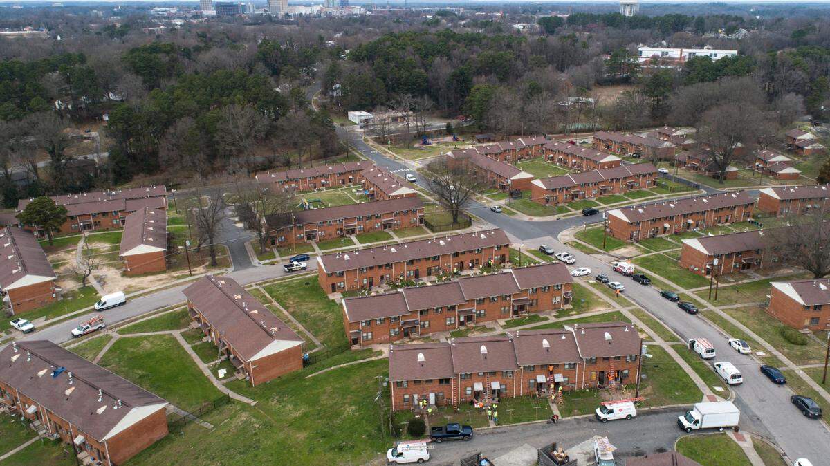 In this 2020 file photo, contractors work on building renovations in McDougald Terrace in February 2020. The Durham Housing Authority started a voluntary evacuation of the public housing complex in early January amid concerns about high carbon monoxide levels, mold and other conditions.
