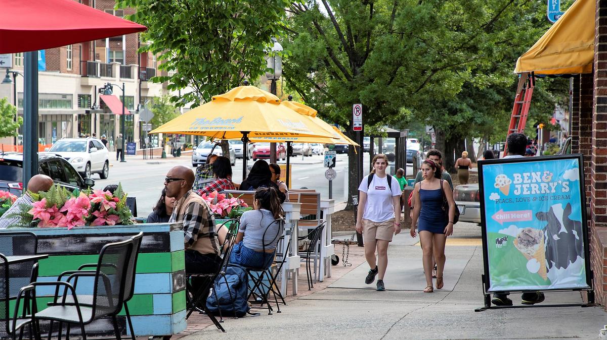 Customers enjoy a sunny day outside Ben & Jerry’s ice cream store on West Franklin Street in this town file photo. The town is looking now at how to add more outdoor dining and retail to Franklin Street during the COVID-19 restrictions.
