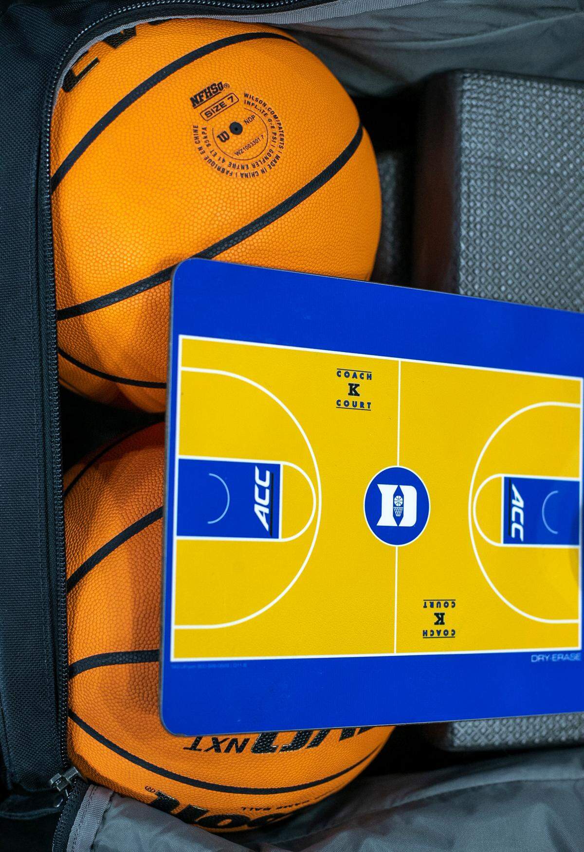 One of Duke’s coaching boards features a diagram of Coach K Court from Cameron Indoor Stadium, spotted in the team’s luggage on Wednesday, March 15, 2023 at the Amway Center in Orlando, Fla.