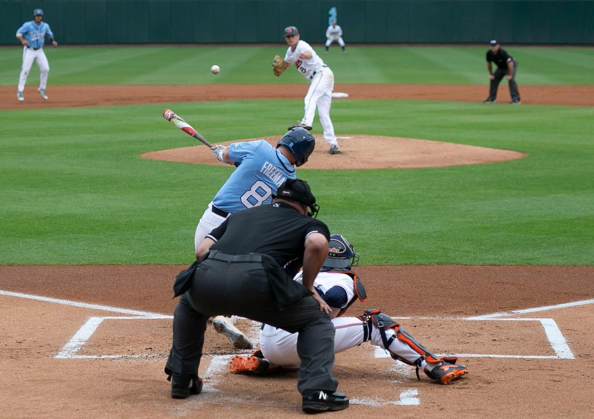 North Carolina’s Ike Freeman (8) connects for a single to left centerfield to score teammates Aaron Sabato and Michael Busch in the first inning against Auburn in the NCAA Super Regional on Sunday, June 9, 2019 at Boshamer Stadium in Chapel Hill, N.C. North Carolina relied on their pitching and defense to defeat Auburn 2-0.