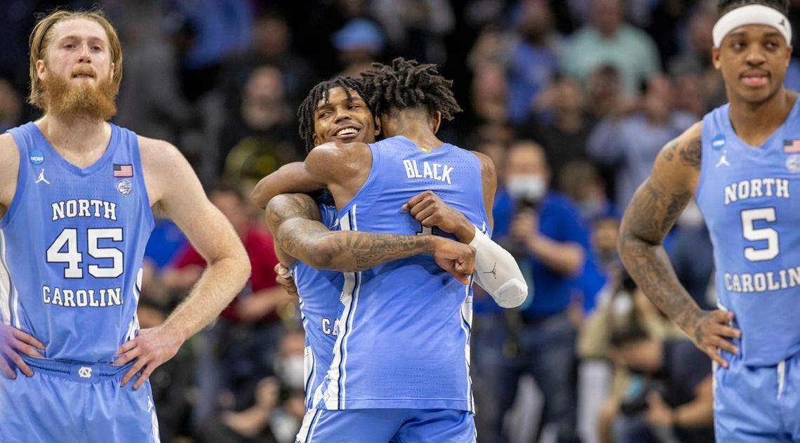 North Carolinas Caleb Love (2) embraces Leaky Black (1) as teammate R.J. Davis (4) shoots the final two free throws with no time on the clock to secure the Tar Heels 73-66 victory over UCLA on Friday, March 25, 2022 during the NCAA East Regional semi-final at Wells Fargo Center in Philadelphia, Pa. Love lead the Tar Heels with 30 points.