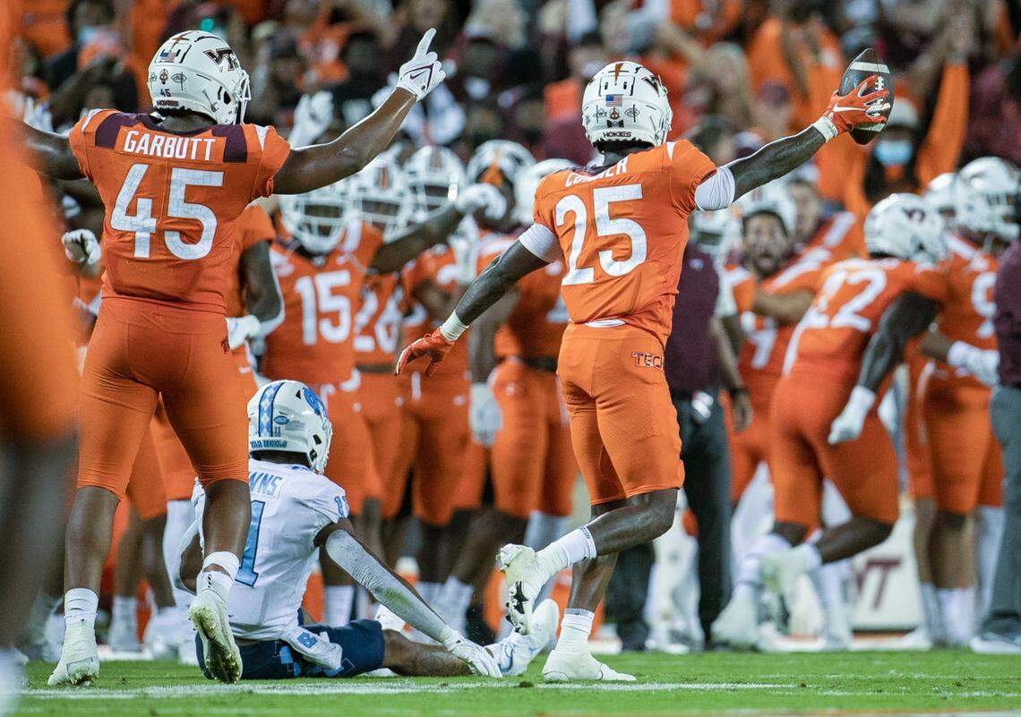 Virginia Tech’s Chamarri Connor (25) reacts after intercepting a pass by North Carolina quarterback Sam Howell, intended for Josh Downs (11) late in the fourth quarter to secure a 17-10 victory for the Hokies on Friday, September 3, 2021 at Lane Stadium in Blacksburg, Va.