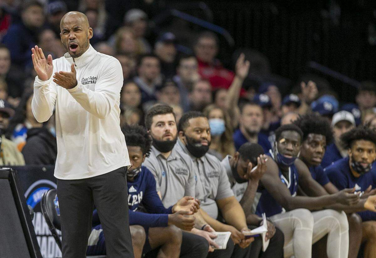 Saint Peters coach Shaheen Holloway applauds his team in the first half against North Carolina during the NCAA East Regional final on Sunday, March 27, 2022 at Wells Fargo Center in Philadelphia, Pa.
