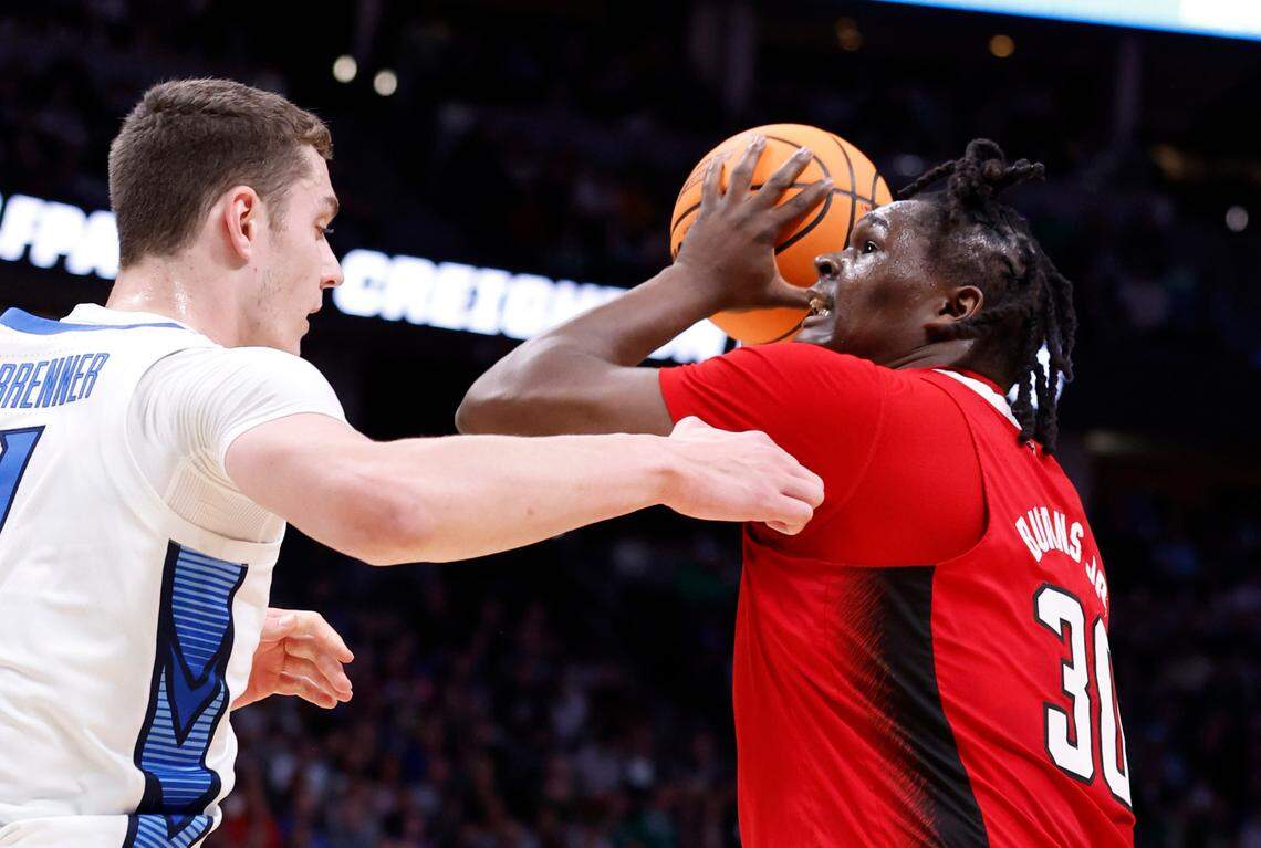 N.C. State’s D.J. Burns Jr. (30) works against Creighton’s Ryan Kalkbrenner (11) during the first half of N.C. State’s game against Creighton in the first round of the NCAA Tournament at Ball Arena in Denver, Colo., Friday, March 17, 2023.
