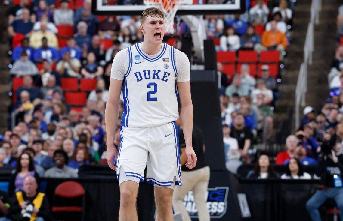 Duke’s Cooper Flagg (2) celebrates after Caleb Foster made a three-pointer during the second half of Duke’s 93-49 victory over Mount St. Mary’s in the first round of the 2025 NCAA Men’s Basketball Tournament at the Lenovo Center in Raleigh, N.C., Friday, March 21, 2025.