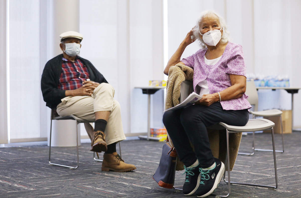 Fledra Hatch, right, and her husband Dr. John W. Hatch, left, wait in an observation area immediately after receiving their COVID-19 vaccines at the Durham County Department of Public Health in Durham, N.C. on Friday, January 8, 2021.