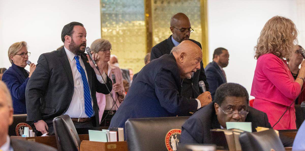 Democrat Representatives lodge a procedural protests prior to a votes an abortion restriction bill passed on the House floor  Wednesday, May 3, 2023 at the State Legislature Building.