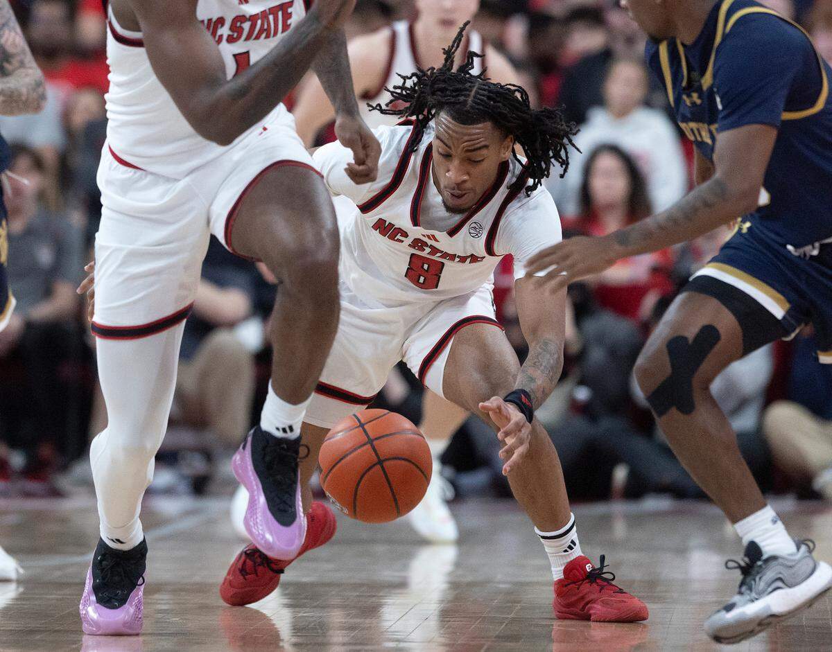 N.C. State’s Jayden Taylor lunges for a loose ball during the first half of the Wolfpack’s 66-65 win over Notre Dame on Wednesday, Jan. 8, 2025, at Lenovo Center in Raleigh, N.C.
