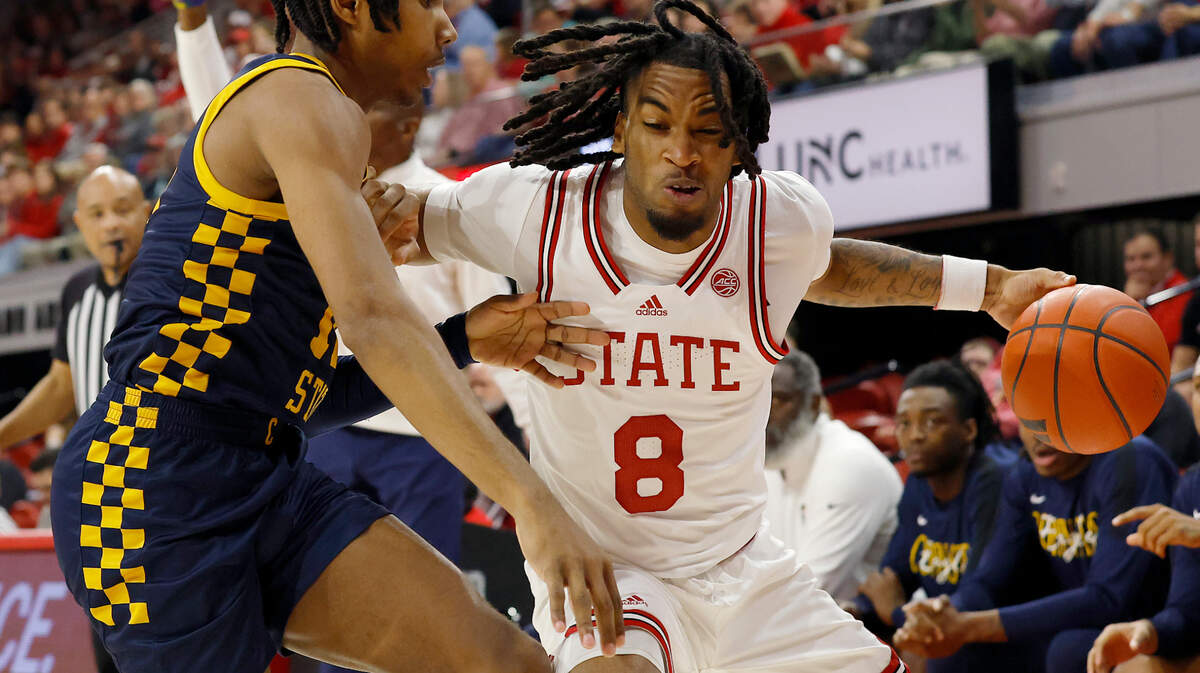 N.C. State’s Jayden Taylor drives the baseline during the first half of the Wolfpack’s game against Coppin State on Tuesday, Dec. 10, 2024, at Reynolds Coliseum in Raleigh, N.C.