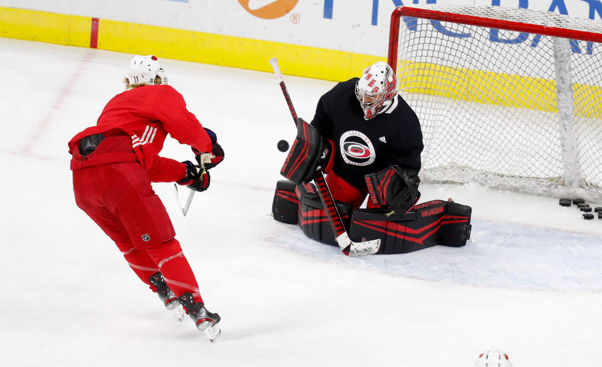 Carolina goaltender Petr Mrazek (34) makes the save on a shot by Jordan Staal (11)during the Carolina Hurricanes’ on-ice workout at PNC Arena in Raleigh, N.C., Monday, July 13, 2020.