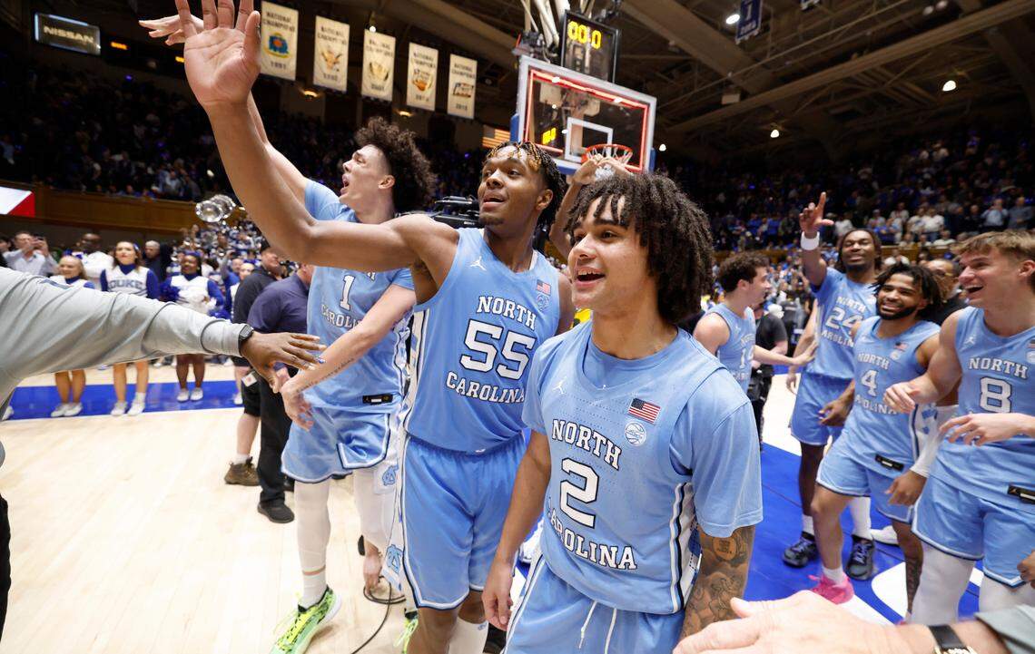 North Carolina’s Harrison Ingram (55) and North Carolina’s Elliot Cadeau (2) motion to the Cameron Crazies after UNC’s 84-79 victory over Duke at Cameron Indoor Stadium in Durham, N.C., Saturday, March 9, 2024.