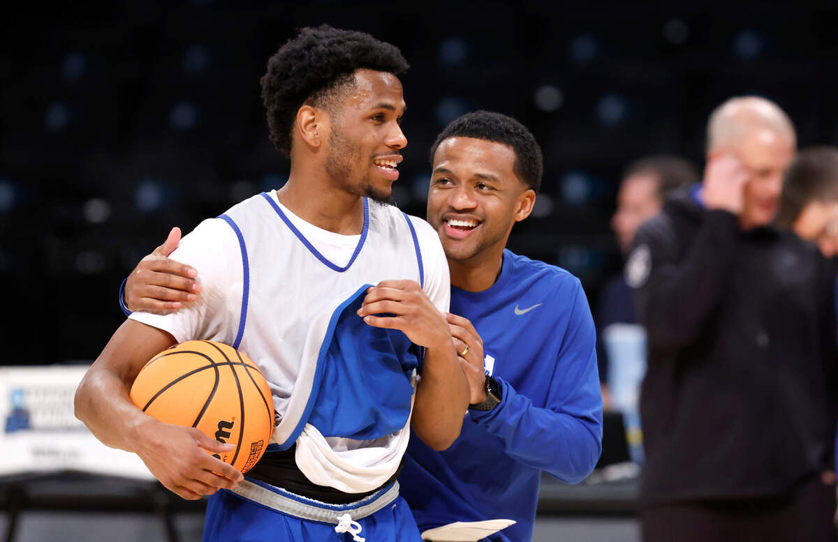 Duke associate head coach Jai Lucas laughs with Jeremy Roach during the Blue Devils’ practice at the Barclays Center in Brooklyn, N.Y., Thursday, March 21, 2024. Duke will face Vermont in the first round of the NCAA Tournament Friday.