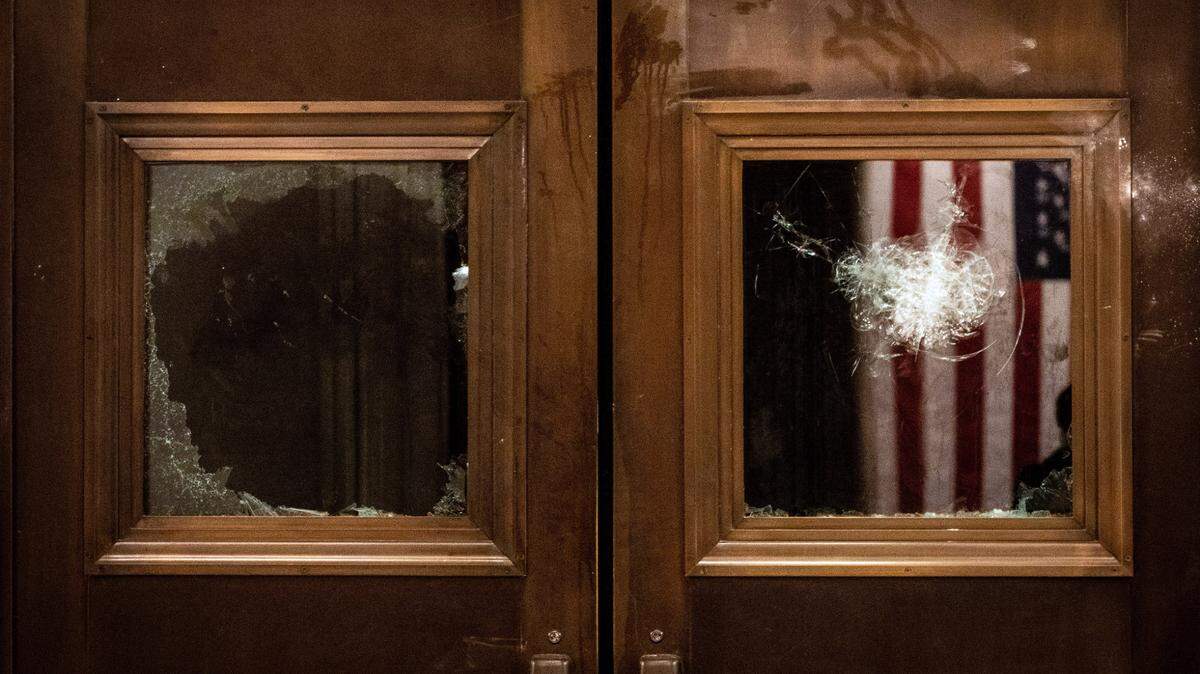 Broken glass on the doors to the entrance of the Capitol Rotunda in Washington, Wednesday, Jan. 6, 2021, the same day as a joint session of Congress met to certify the electoral votes from the 2020 presidential election. President TrumpÕs efforts to overturn the 2020 presidential election came to a dangerous head on Wednesday when a mob of his supporters stormed the Capitol following a rally in which Trump once again falsely claimed widespread voter fraud.