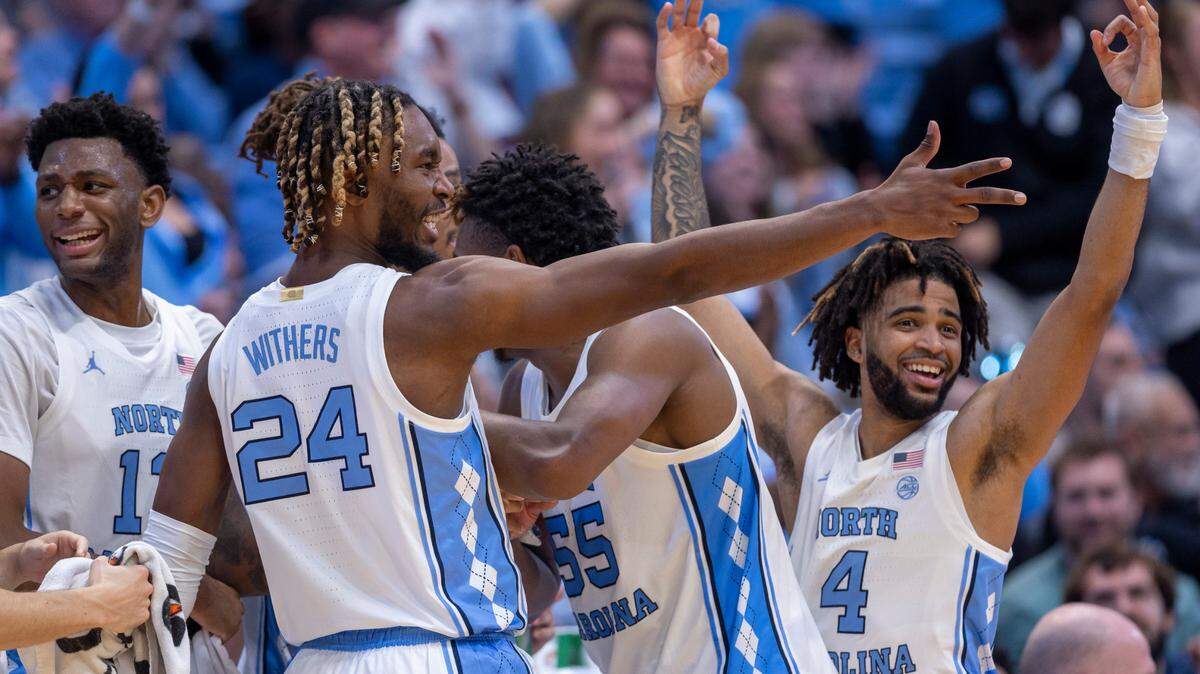 North Carolina’s Jalen Washington (13), Jae’Lyn Withers (24), Harrison Ingram (55) and R.J. Davis (4) celebrate after a basket by reserve player Rob Landry (22) to give the Tar Heels a 90-65 lead in the final minute of play against Lehigh on Sunday, November 12, 2023 at the Smith Center in Chapel Hill, N.C.