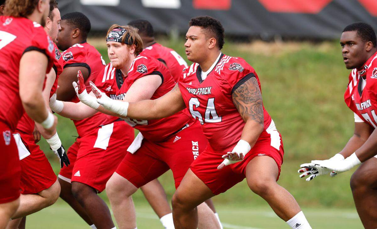 N.C. State offensive lineman Chandler Zavala (64) participates in drills during the Wolfpack’s first practice in Raleigh, N.C., Wednesday, August 4, 2021.