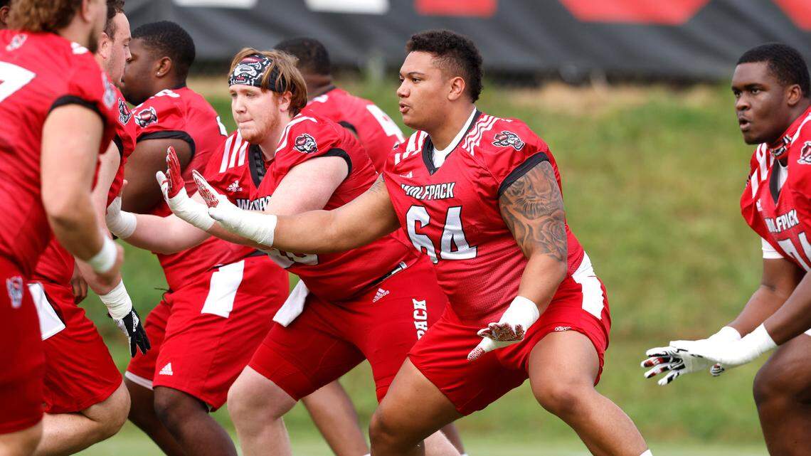 N.C. State offensive lineman Chandler Zavala (64) participates in drills during the Wolfpack’s first practice in Raleigh, N.C., Wednesday, August 4, 2021.