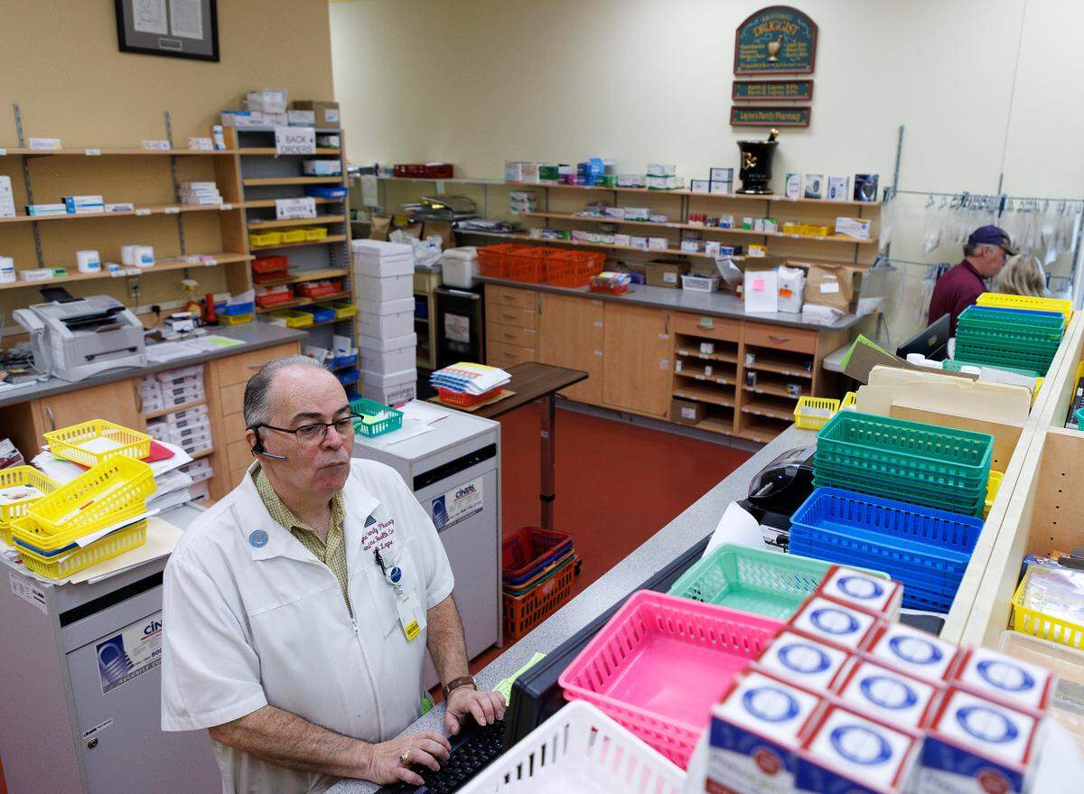 Pharmacist Keith Layne works at Layne’s Family Pharmacy on Wednesday, Aug. 14, 2024, in Eden, N.C.
